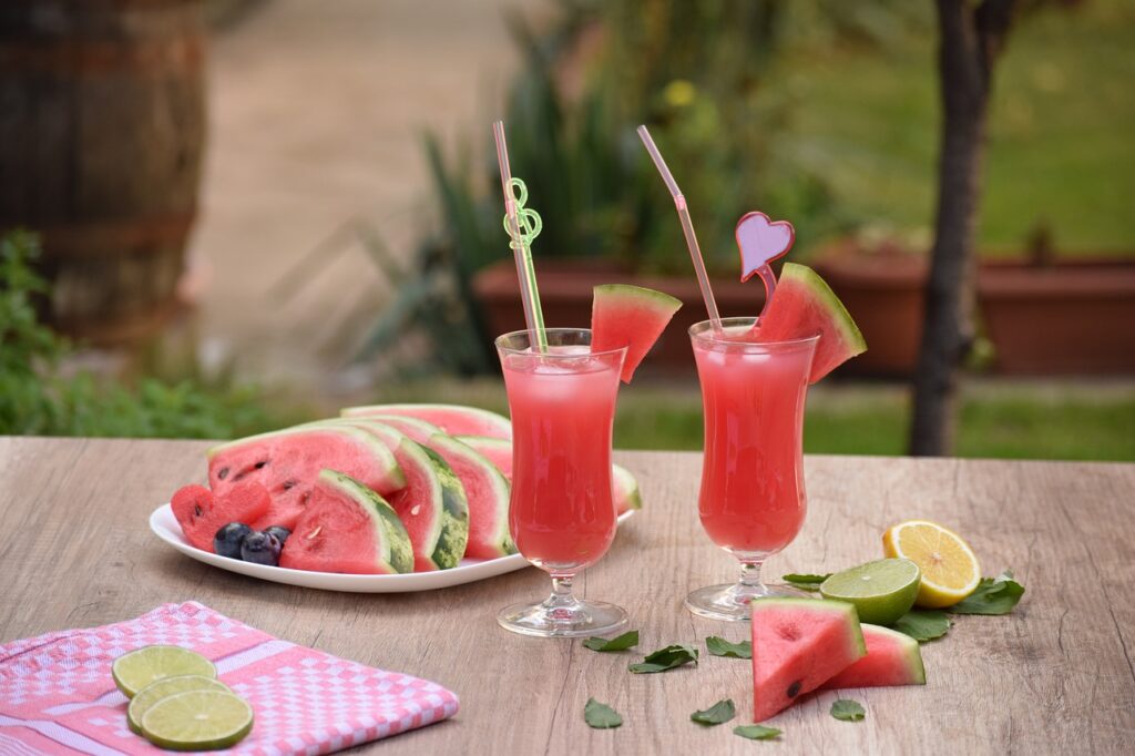 A refreshing drink and watermelon a cozy table setting